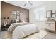 Stylish bedroom with white bedding and modern decor, showcasing a cozy retreat at 771 Dutton Ct, Castle Rock, CO 80104