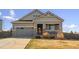 Charming home featuring a covered porch, stone accents, and a well-manicured front yard at 771 Dutton Ct, Castle Rock, CO 80104