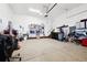 A clean garage interior with a painted floor and ample storage shelves at 771 Dutton Ct, Castle Rock, CO 80104