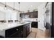 Open concept kitchen with white countertops, stainless steel appliances, and hardwood floors at 771 Dutton Ct, Castle Rock, CO 80104