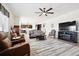 Open-concept living room with hardwood floors and seamless flow to the kitchen at 771 Dutton Ct, Castle Rock, CO 80104