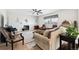 Inviting living room with a fireplace, comfortable seating, and hardwood flooring at 771 Dutton Ct, Castle Rock, CO 80104