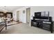 Open concept living room with hardwood floors and adjacent dining area at 22336 E Bellewood Dr, Aurora, CO 80015