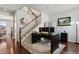 Office space next to stairs with hardwood floors and neutral colored walls at 22336 E Bellewood Dr, Aurora, CO 80015