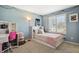 Cute bedroom featuring light-blue walls, a window with shutters and carpeted floor at 22336 E Bellewood Dr, Centennial, CO 80015