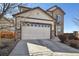 Charming two-story home featuring a stone facade and a two-car garage at 22336 E Bellewood Dr, Aurora, CO 80015