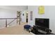 Open hallway with a view of the staircase and media room at 22336 E Bellewood Dr, Aurora, CO 80015