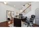 Bright home office with dark wood floors, and a modern desk at 22336 E Bellewood Dr, Centennial, CO 80015