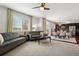 Bright and airy living room that seamlessly connects to the dining area and kitchen at 22336 E Bellewood Dr, Aurora, CO 80015