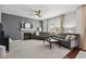 Inviting living room featuring a cozy fireplace, plush sofas, and ample natural light at 22336 E Bellewood Dr, Aurora, CO 80015