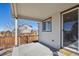 Covered patio with concrete flooring, a sliding door, and view of the fenced backyard at 22336 E Bellewood Dr, Aurora, CO 80015