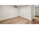 Bedroom with double door closet and modern wood flooring at 9405 W 54Th Pl, Arvada, CO 80002
