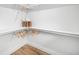 Walk-in closet featuring white shelving, hanging rods, and ample storage space for clothes and accessories at 9405 W 54Th Pl, Arvada, CO 80002