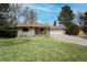 Charming single story home with a well-manicured lawn and attached two car garage at 9405 W 54Th Pl, Arvada, CO 80002