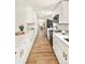 Updated, stylish kitchen features stainless steel appliances, and quartz countertops at 9405 W 54Th Pl, Arvada, CO 80002