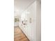 Modern kitchen with white cabinets, stainless steel appliances, and quartz countertops at 9405 W 54Th Pl, Arvada, CO 80002
