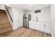 Finished basement kitchenette with stainless steel fridge and new cabinets at 9405 W 54Th Pl, Arvada, CO 80002