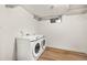 Bright laundry room with modern washer and dryer at 9405 W 54Th Pl, Arvada, CO 80002