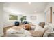 Bright and airy living room with a comfortable couch, chairs and hardwood floors at 9405 W 54Th Pl, Arvada, CO 80002