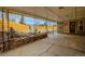 View of a covered patio with a rock and stone garden, leading to a fenced backyard at 9405 W 54Th Pl, Arvada, CO 80002
