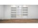Bright and spacious built-in shelving with recessed lighting and wood floors at 9405 W 54Th Pl, Arvada, CO 80002