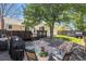 Serene backyard featuring a stone patio, grill, and a lush lawn, ideal for relaxation and outdoor activities at 8281 Johnson St, Arvada, CO 80005