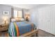 Cozy bedroom with hardwood floors, large closet, and a sunny window at 8281 Johnson St, Arvada, CO 80005