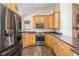 Modern kitchen with stainless steel appliances, ample cabinetry, and stylish countertops at 8281 Johnson St, Arvada, CO 80005