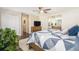 Spacious bedroom featuring wood floors, ceiling fan and an ensuite bathroom at 8281 Johnson St, Arvada, CO 80005