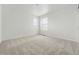 Cozy bedroom with two large windows providing ample natural light at 17747 Prairie Peak Trl, Parker, CO 80134
