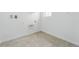 Laundry room with tile floor, window and utility connections at 17747 Prairie Peak Trl, Parker, CO 80134
