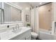 Clean and bright basement bathroom with bathtub and modern vanity at 6551 S Harlan Ct, Littleton, CO 80123