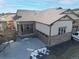 Ranch style home with driveway and landscaping visible from above at 17412 W 93Rd Pl, Arvada, CO 80007