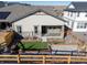 Aerial view highlighting the home's backyard oasis with patio and landscaping at 17412 W 93Rd Pl, Arvada, CO 80007