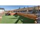 Artificial turf backyard with tiered retaining walls and planters at 17412 W 93Rd Pl, Arvada, CO 80007