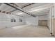 Unfinished basement with concrete floors and exposed beams at 17412 W 93Rd Pl, Arvada, CO 80007