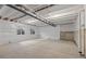 Spacious unfinished basement with concrete floor and exposed ceiling, providing potential for customization and expansion at 17412 W 93Rd Pl, Arvada, CO 80007