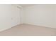 Clean empty bedroom showcasing neutral carpeting and double door closet at 17412 W 93Rd Pl, Arvada, CO 80007