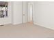 Bedroom with carpet, window, and door to hallway at 17412 W 93Rd Pl, Arvada, CO 80007