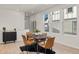 Bright dining area featuring modern table and chairs with great natural light from the large windows at 17412 W 93Rd Pl, Arvada, CO 80007