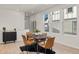 Bright dining area with four chairs and hardwood floors at 17412 W 93Rd Pl, Arvada, CO 80007