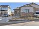 Inviting single-Gathering home with stone accents and a spacious driveway. A white Jeep stands ready on the driveway at 17412 W 93Rd Pl, Arvada, CO 80007