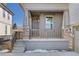 Covered front porch with stone and wood details at 17412 W 93Rd Pl, Arvada, CO 80007