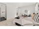 Bright bedroom with a comfortable seating area and views of the outdoor scenery at 17412 W 93Rd Pl, Arvada, CO 80007