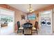 Cozy dining area with a view to a sunny living room and laundry at 2230 Miller Ct, Lakewood, CO 80215