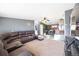 Spacious living room with large sectional sofa and flat-screen TV at 9039 Orleans St, Denver, CO 80260