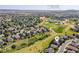 Aerial view showing a neighborhood, nearby parks, golf course, and elementary school at 2980 Craig Ct, Castle Rock, CO 80109