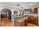 Custom bar featuring granite countertops, wood cabinetry, and wine storage, perfect for entertaining guests at 2980 Craig Ct, Castle Rock, CO 80109