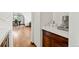 Butler's pantry boasts marble countertops, dark wood cabinets and open view to the dining and living rooms at 2980 Craig Ct, Castle Rock, CO 80109