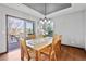 Dining room with hardwood flooring, tray ceiling, a patio door to the deck and ample seating at 2980 Craig Ct, Castle Rock, CO 80109